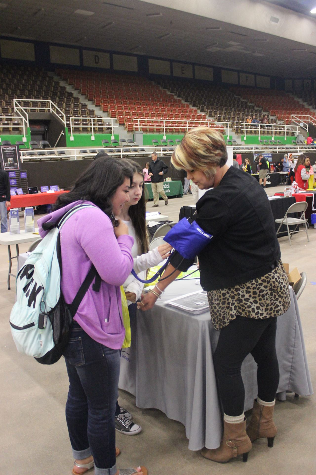 Students learn how to complete a blood pressure check.